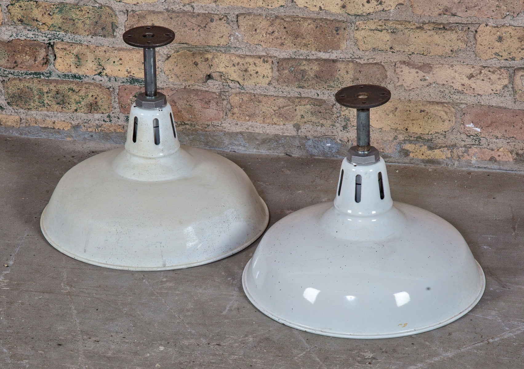 two matching rewired american depression-era white porcelain enameled factory machine shop pendant lights