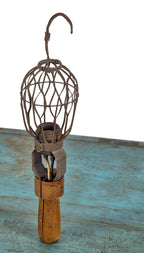 hard to find early 20th century american industrial trouble light with single socket and allover crazed turned wood handle