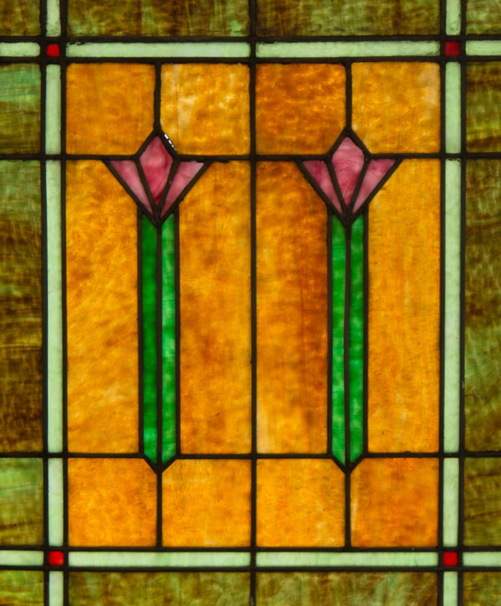 one of two completely intact and richly colored salvaged chicago bungalow windows with abstract floral motifs
