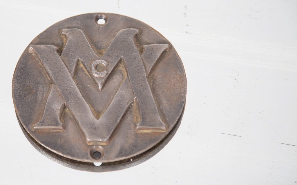 c. 1922 historically important monogrammed theater cast iron seat plaque removed from the non-extant mcvickers theater prior to demolition in 1985