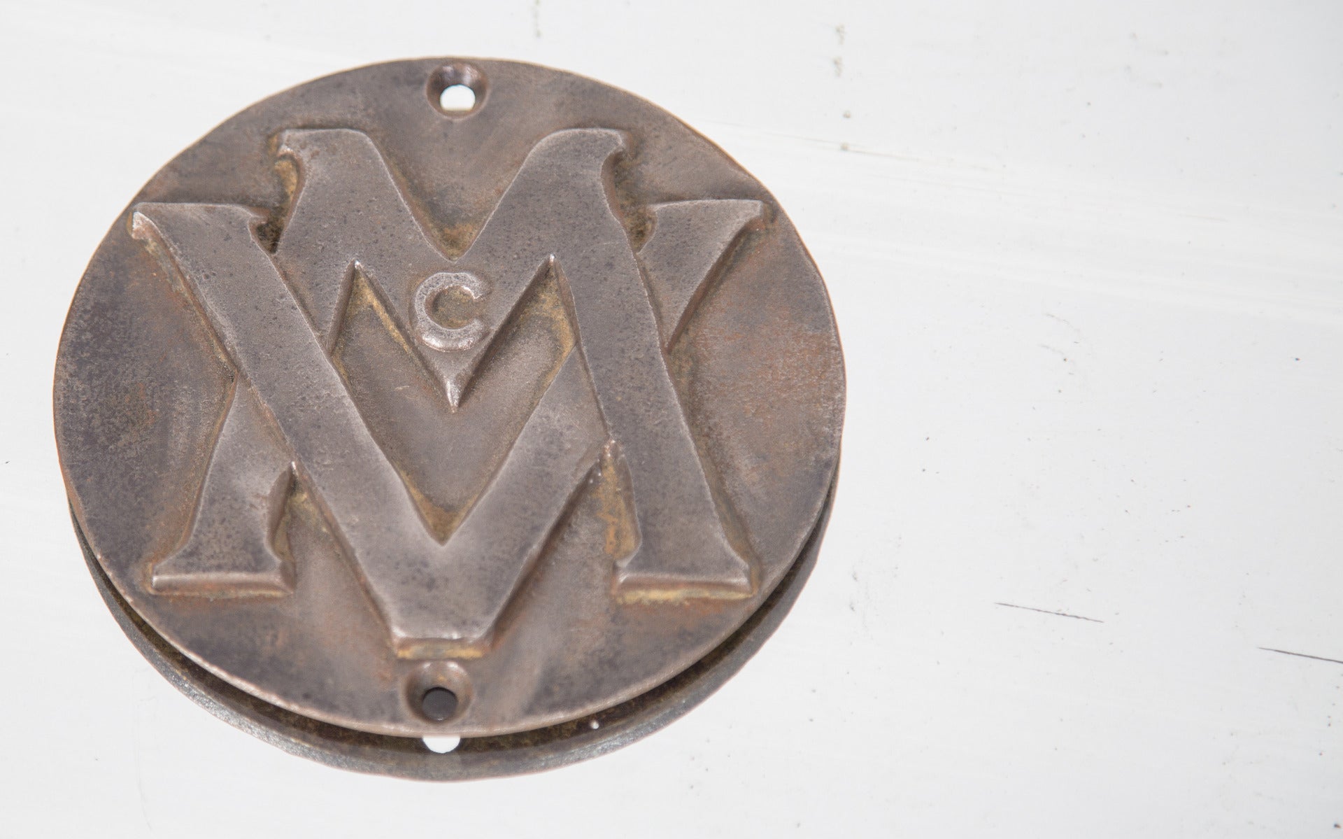 c. 1922 historically important monogrammed theater cast iron seat plaque removed from the non-extant mcvickers theater prior to demolition in 1985