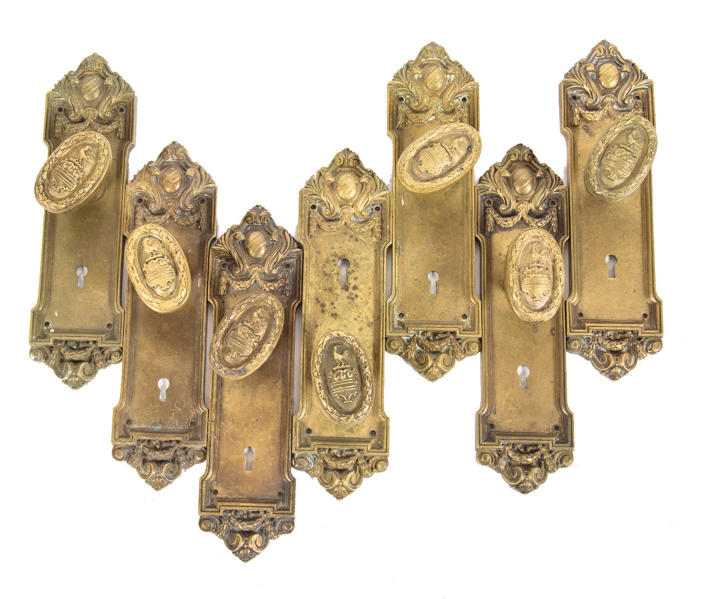 group of all original early 20th century salvaged chicago cast brass blackstone hotel room passage door figural doorknobs and backplates