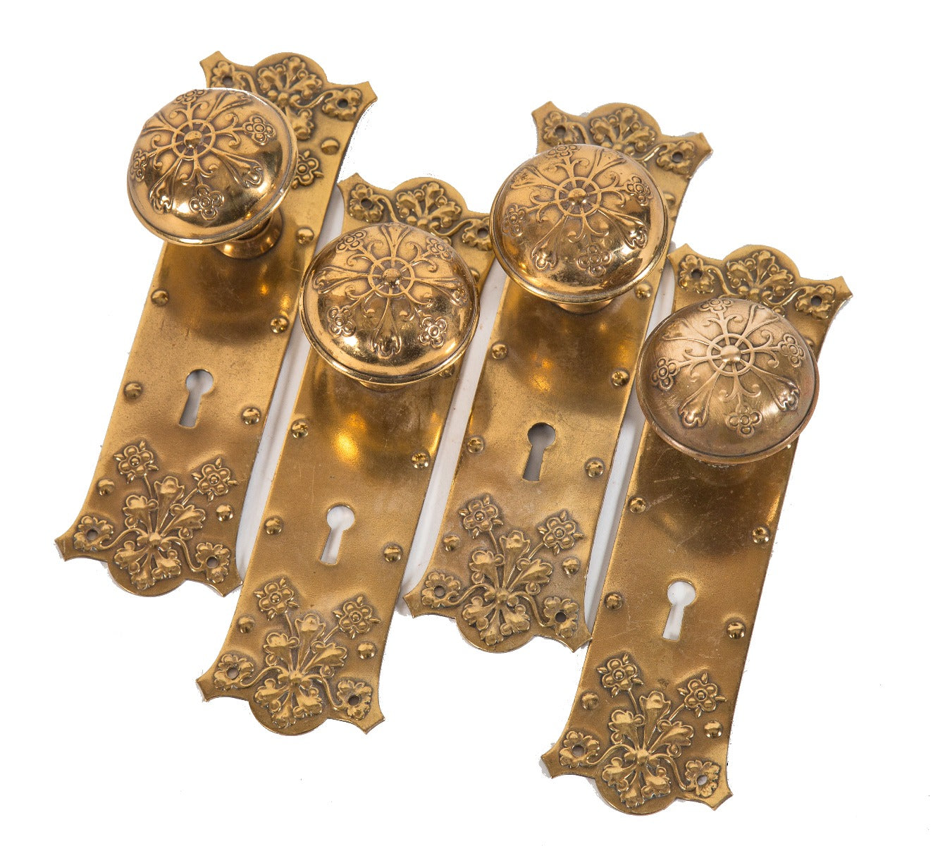 matching set of original early 20th century ornamental wrought brass salvaged chicago interior passage door knobs and backplates