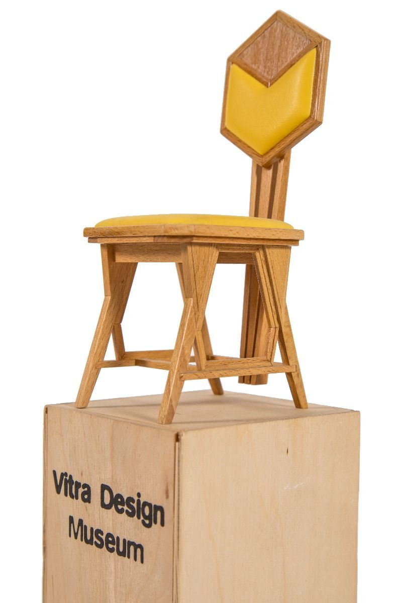 rare vitra miniature recreation of frank lloyd wright's yellow oil cloth "peacock" chair for imperial hotel