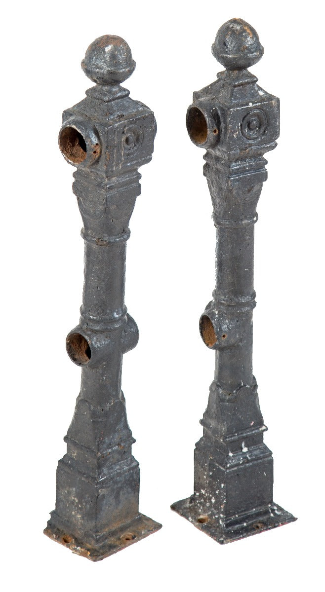 pair of original and intact black enameled cast iron salvaged chicago exterior residential newel posts with ball finials