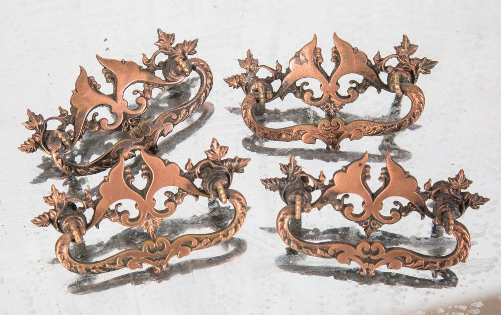 tweleve matching original late 19th or early 20th century copper-plated cast brass victorian drawer pulls
