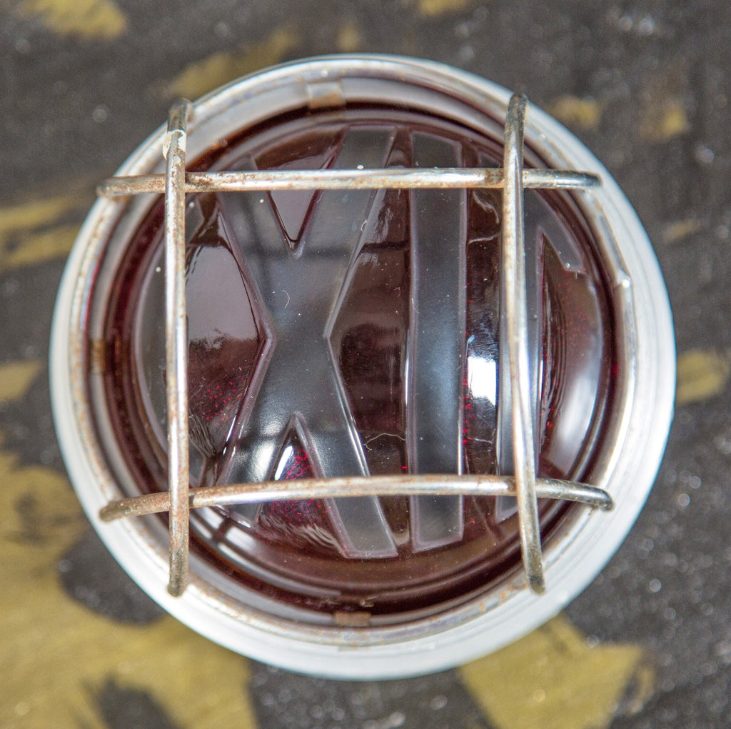 hard to find and highly desirable wall-mount illuminated art deco exit sign surrounded by aluminum cage guard