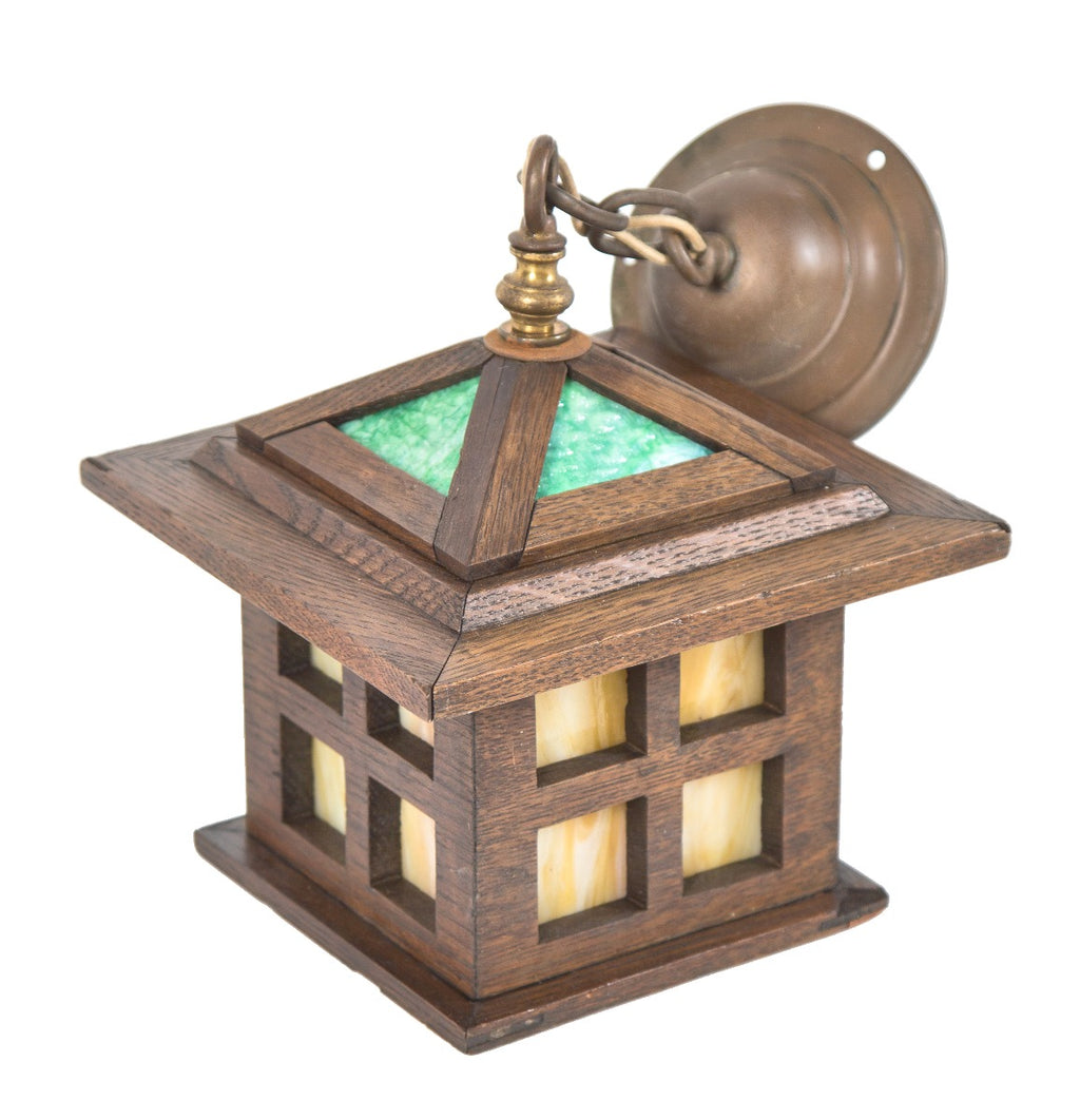 rare original and intact early 20th century salvaged chicago craftsman style varnished oak wood residential pedant light or lantern with slag glass