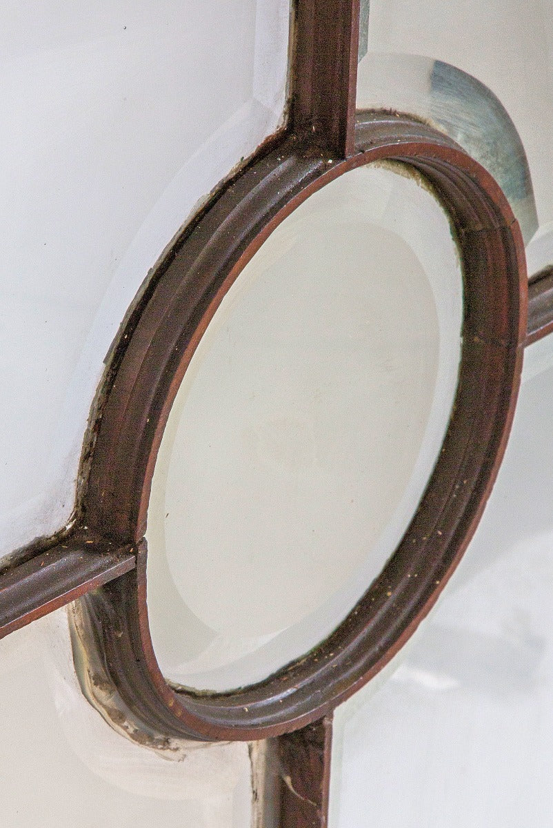 unusually designed all original salvaged chicago 1880's oversized deeply cut beveled glass window with wood muntin oculus