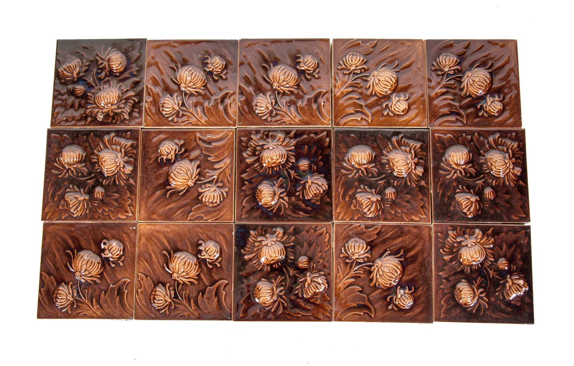 large lot of matching salvaged chicago richly colored majolica-glazed residential 6 x 6 fireplace tiles with deeply embossed floral motifs