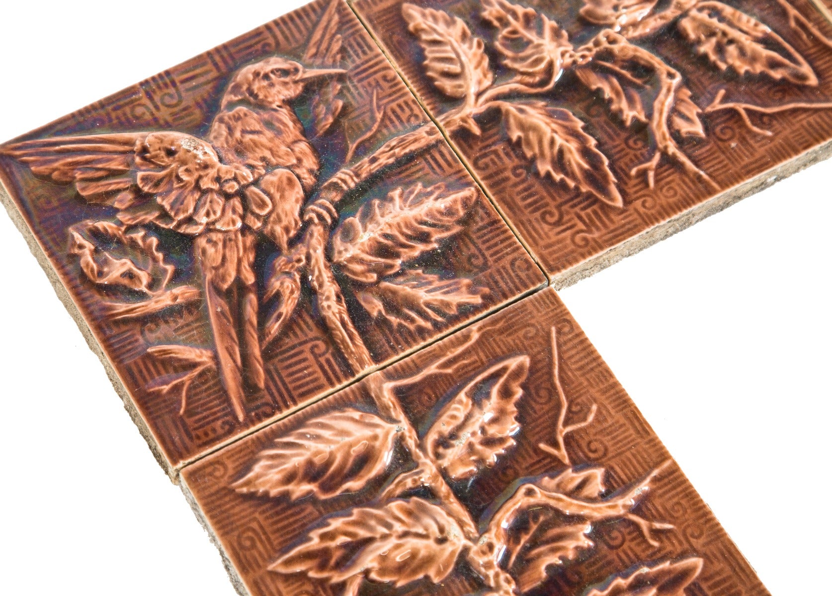 rare all original dark mauve majolica-glazed interior residential salvaged chicago fireplace tile surround with spread-winged bird corner tiles