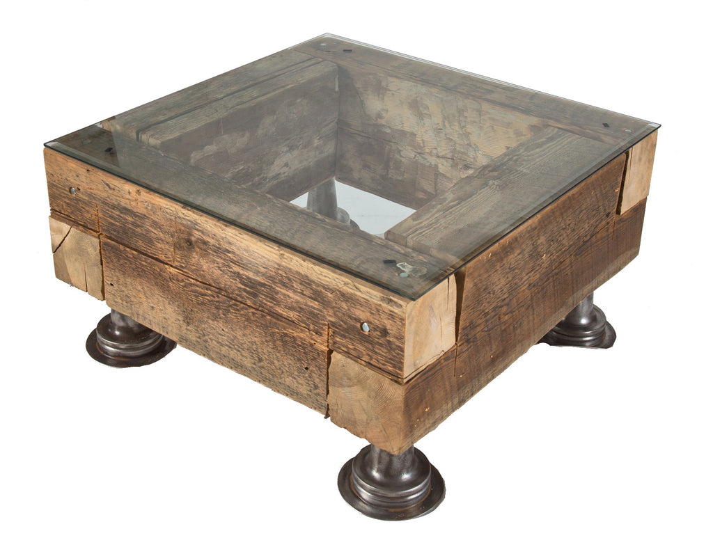 repurposed compact low-lying old growth pine wood sill plate beam coffee table with a. finkl steel flanges and beveled edge plate glass top