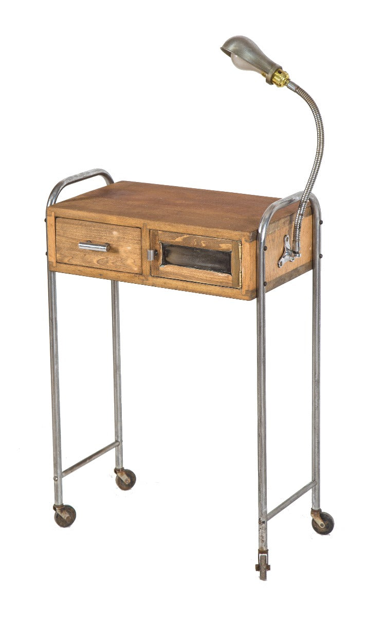 refinished antique american art deco mobile helene curtis work stand with bent tubular steel legs and integrated gooseneck lamp