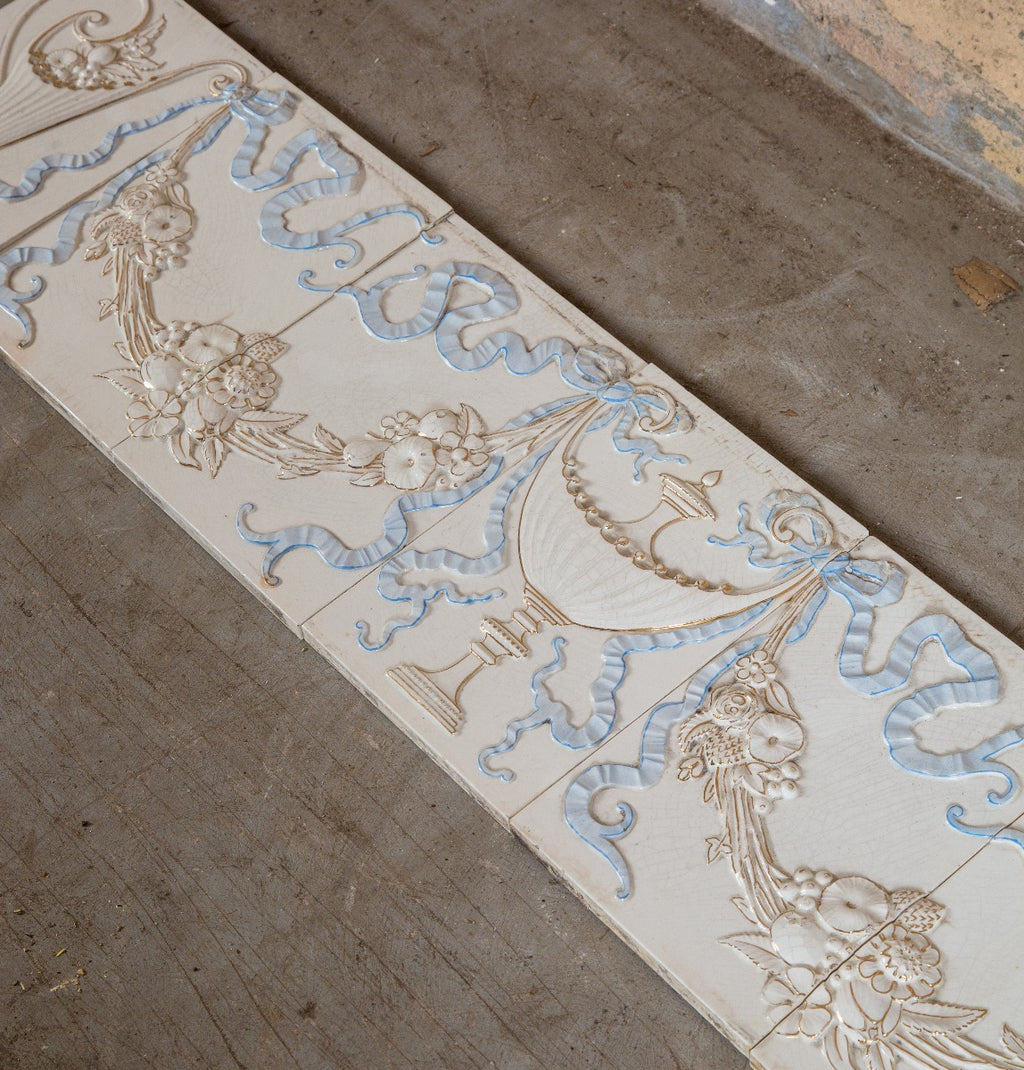 seldom found all original late 19th century antique american embossed white and blue glazed fireplace tile surround with gold accent