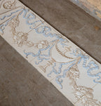 seldom found all original late 19th century antique american embossed white and blue glazed fireplace tile surround with gold accent