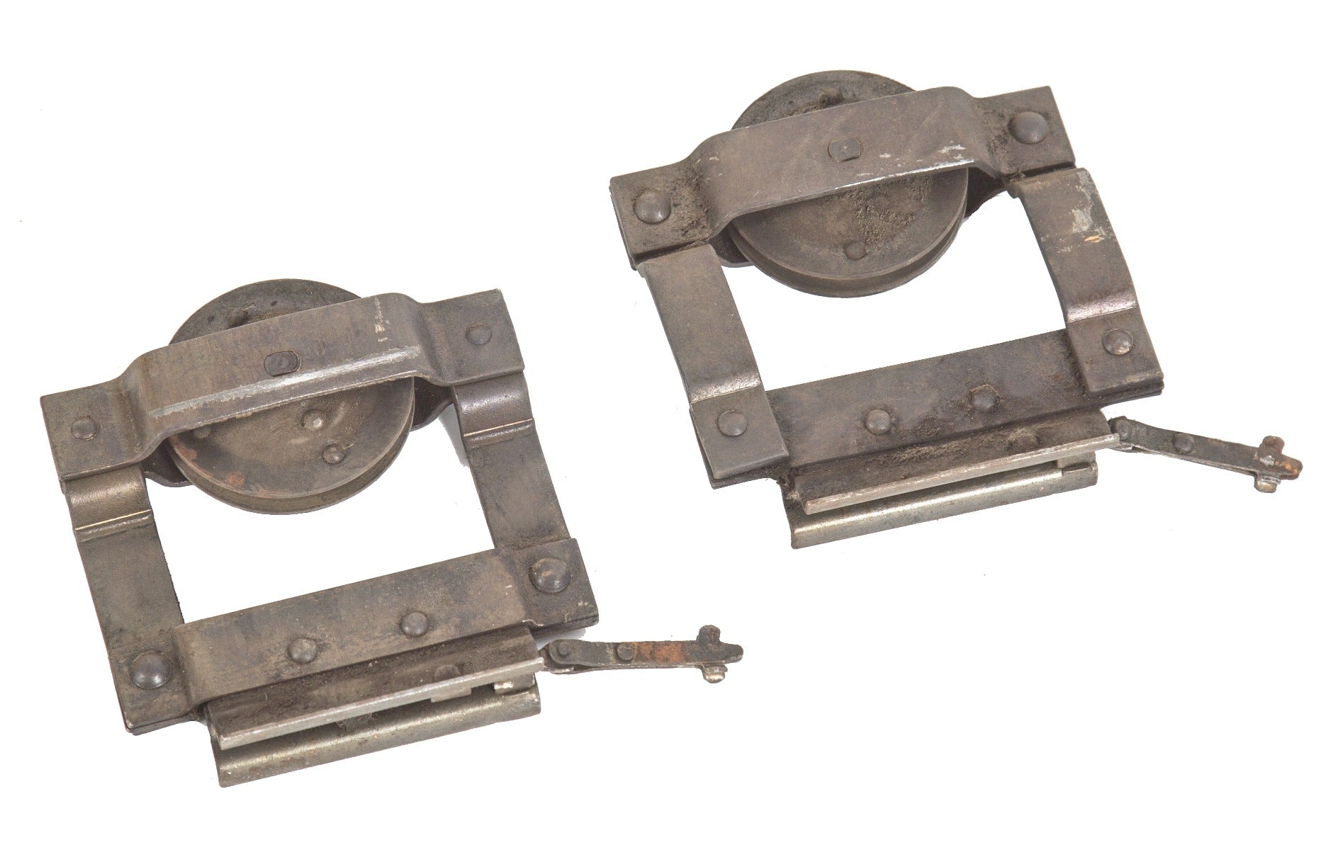 two matching hard to find original late 19th century riveted joint steel residential pocket door hangers with integrated rollers