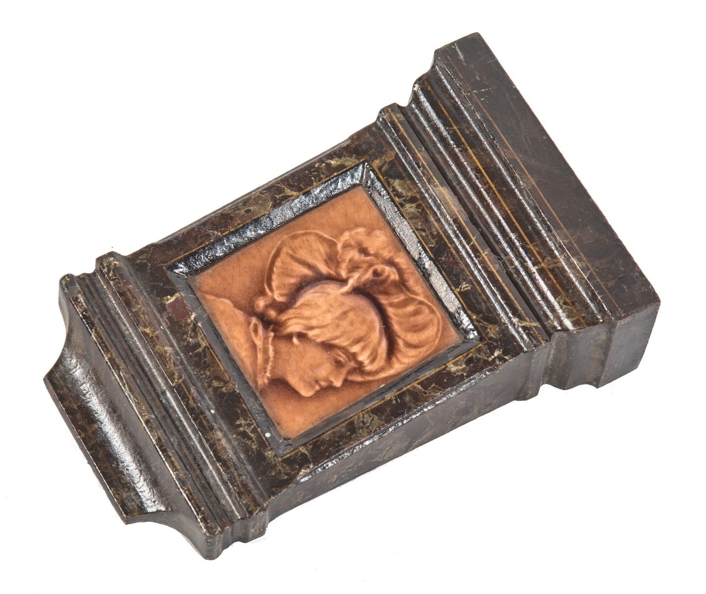 original and intact salvaged chicago cast iron fireplace mantel keystone with centrally located figural majolica tile