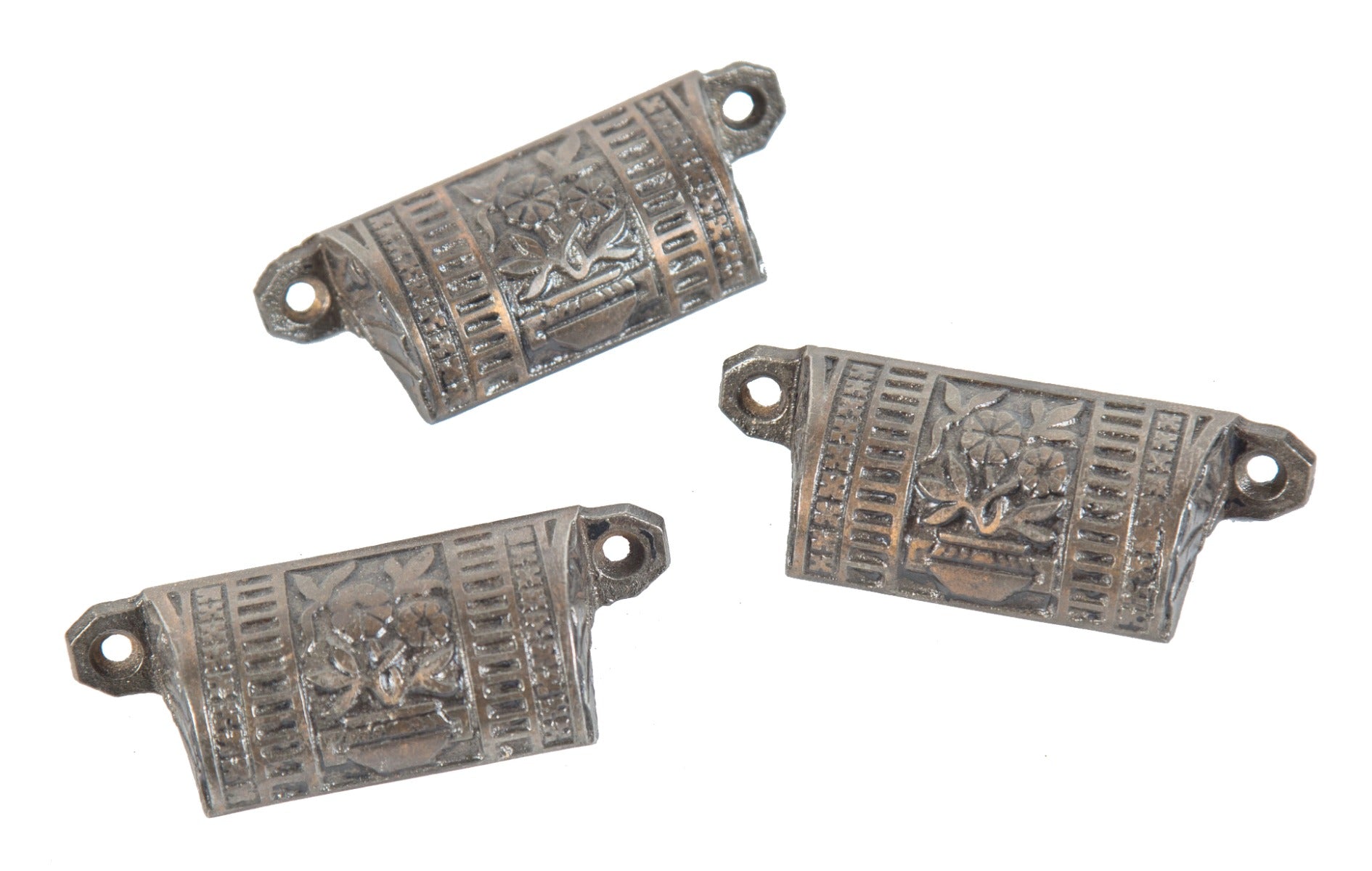 group of three matching ornamental cast iron kitchen or pantry cabinet door or drawer pulls with potted plants and copper plating