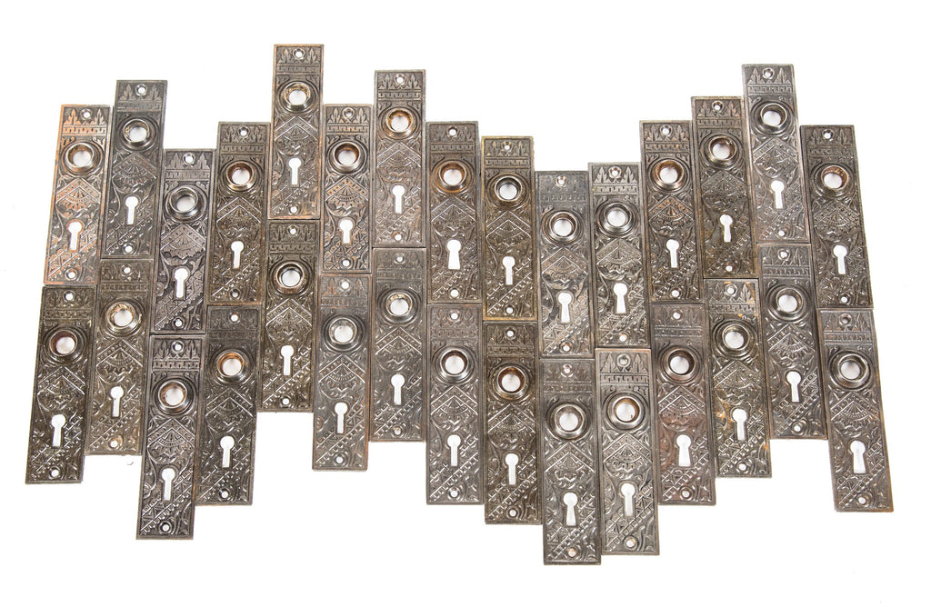 large lot of original matching 19th century american eastlake style "oriental" pattern residential passage door plates