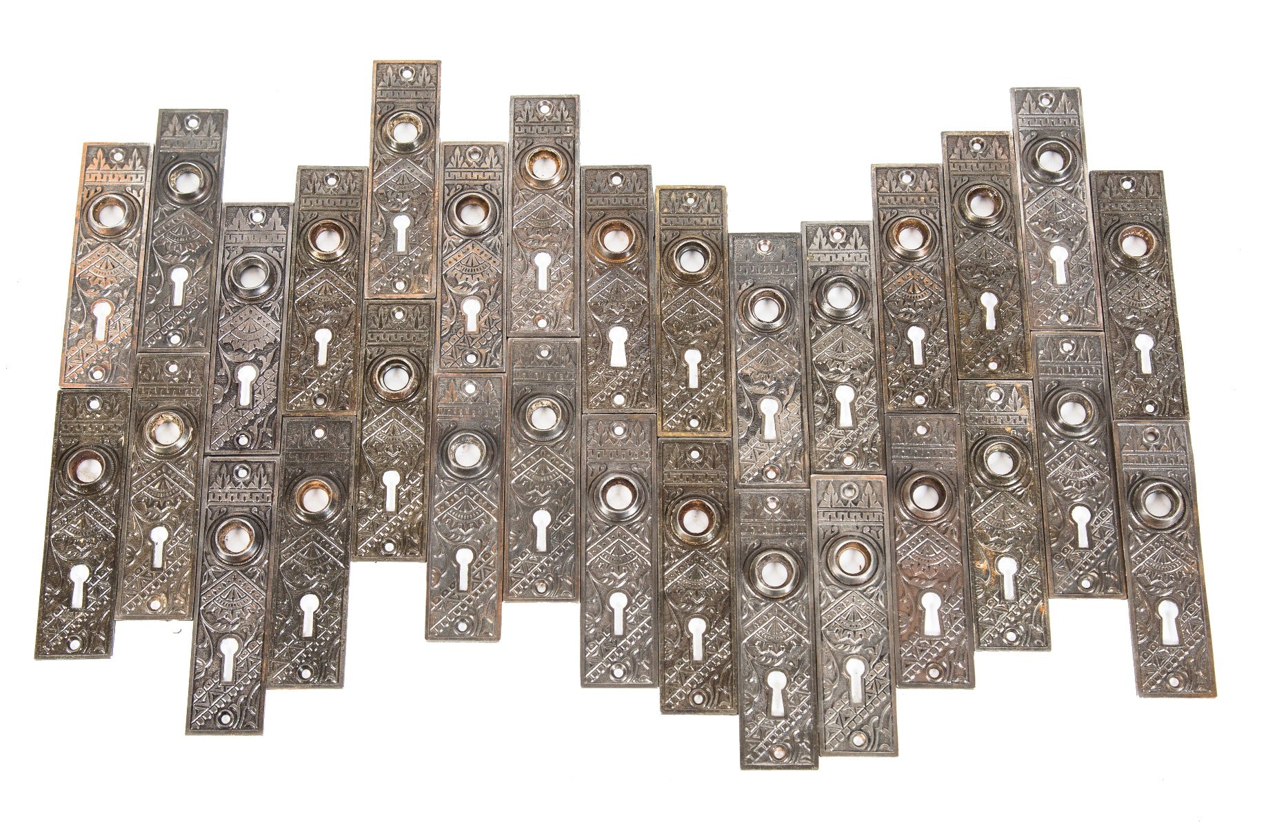 large lot of original matching 19th century american eastlake style "oriental" pattern residential passage door plates