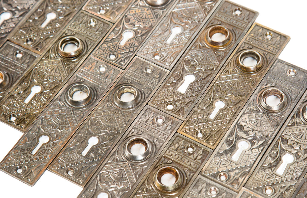large lot of original matching 19th century american eastlake style "oriental" pattern residential passage door plates