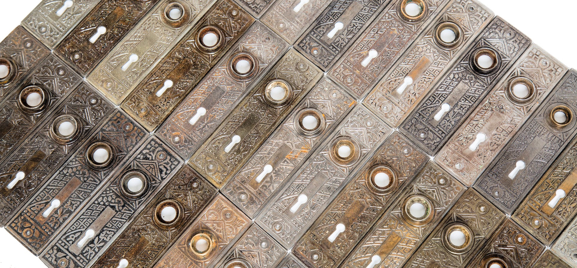 huge lot of original late 19th or early 20th century salvaged chicago "ceylon" pattern ornamental passage door backplates