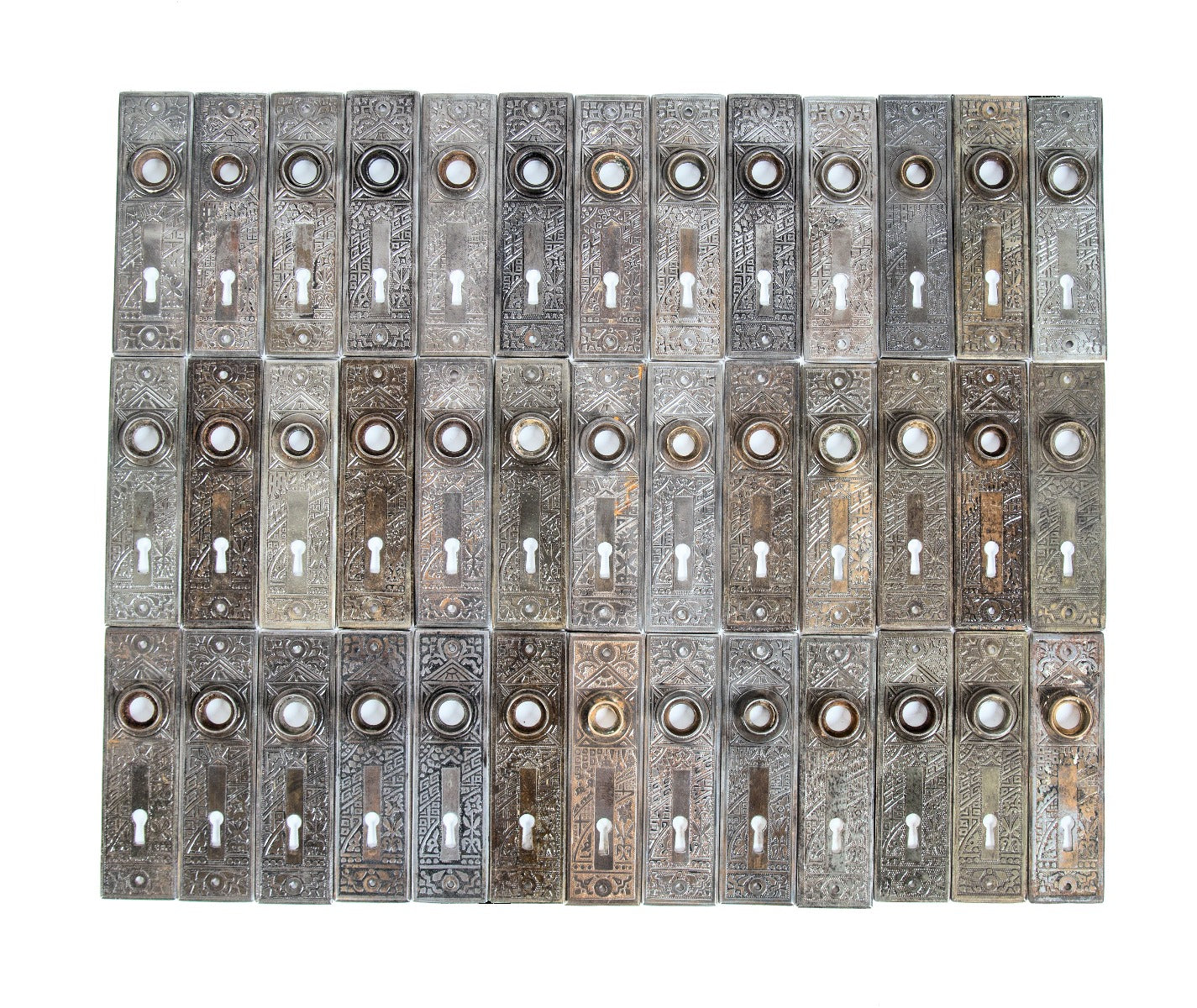 huge lot of original late 19th or early 20th century salvaged chicago "ceylon" pattern ornamental passage door backplates