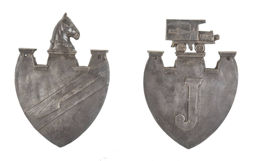 pair of original historically important depression-era salvaged chicago jackson's express and van company building figural plaques