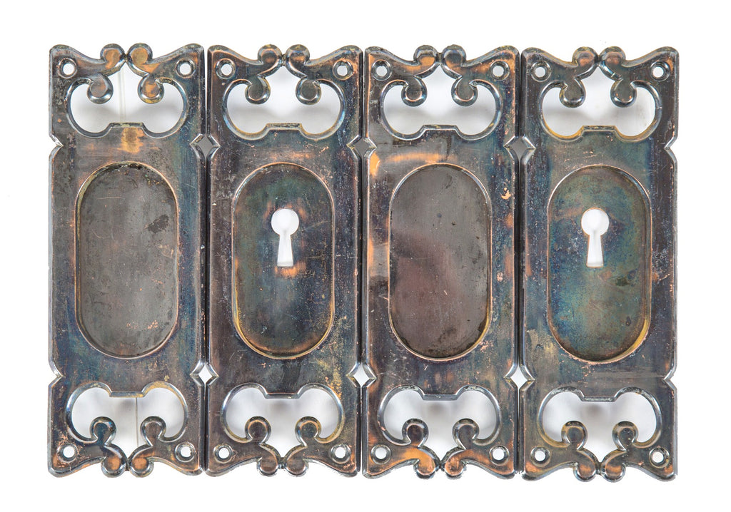 one of two matching lots of late 19th century ornamental cast bronze interior residential pocket door plates