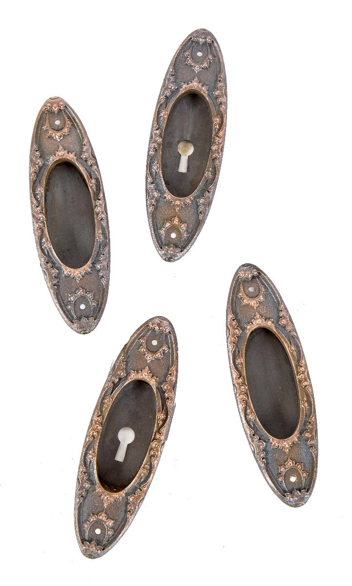 group of four matching all original salvaged chicago early 20th century cast bronze pocket door handles