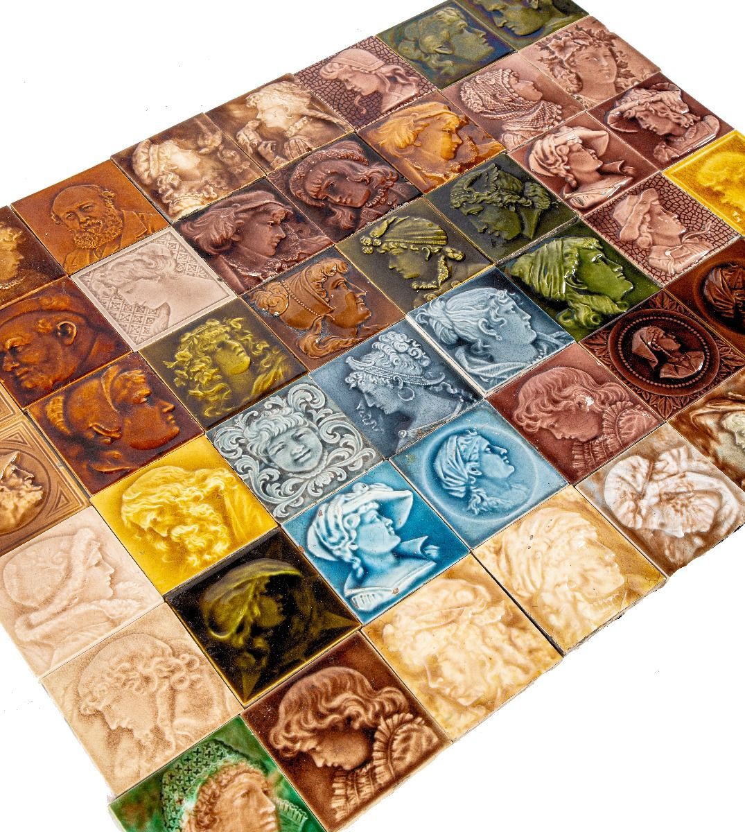 deeply embossed and lavishly colored butterscotch majolica glazed costumed figure or portrait fireplace corner tile