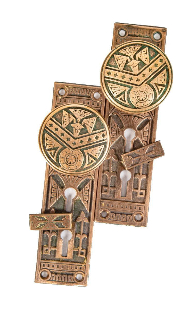 matching set of original ornamental cast brass eastlake style exterior residential door hardware with chevron design