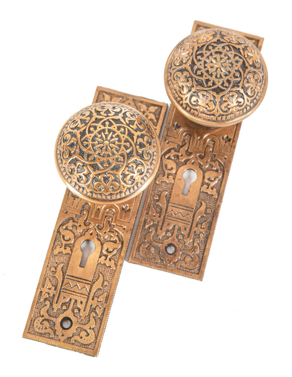 heavily ornamented 1880's cast bronze high victorian-era salvaged new york city dome-shaped doorknobs with matching backplates