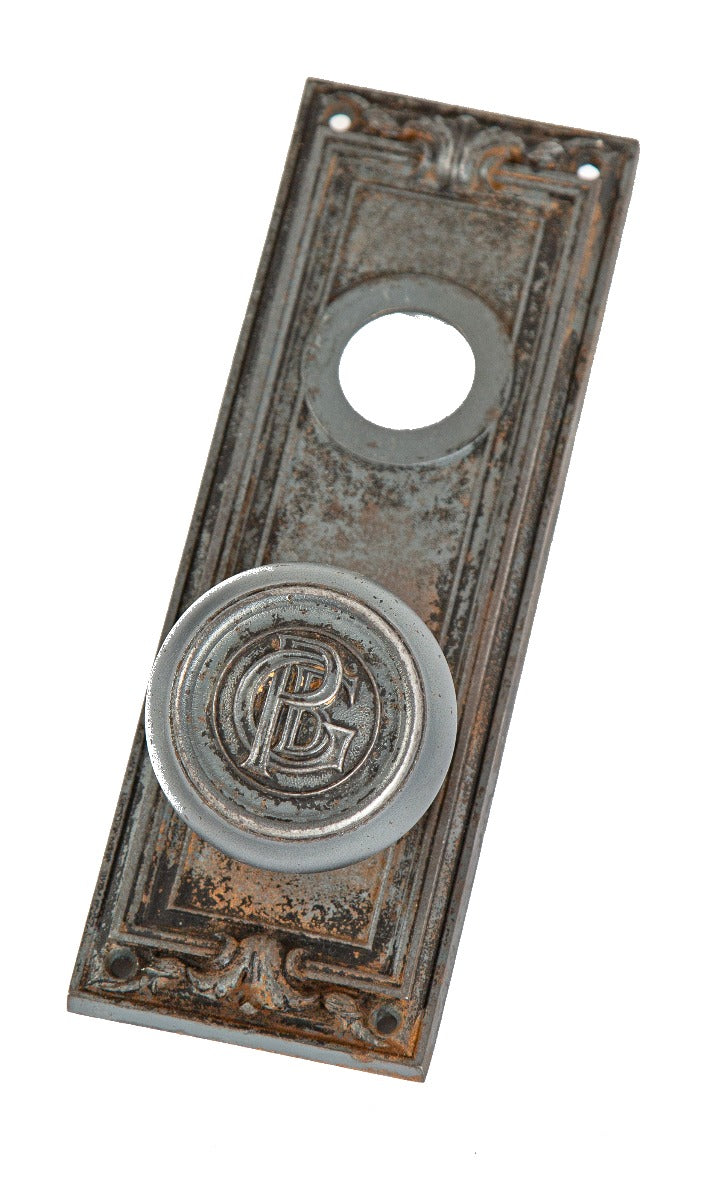historically important early 20th century ornamental cast iron monogrammed d.h. burnham's peoples gas building door hardware