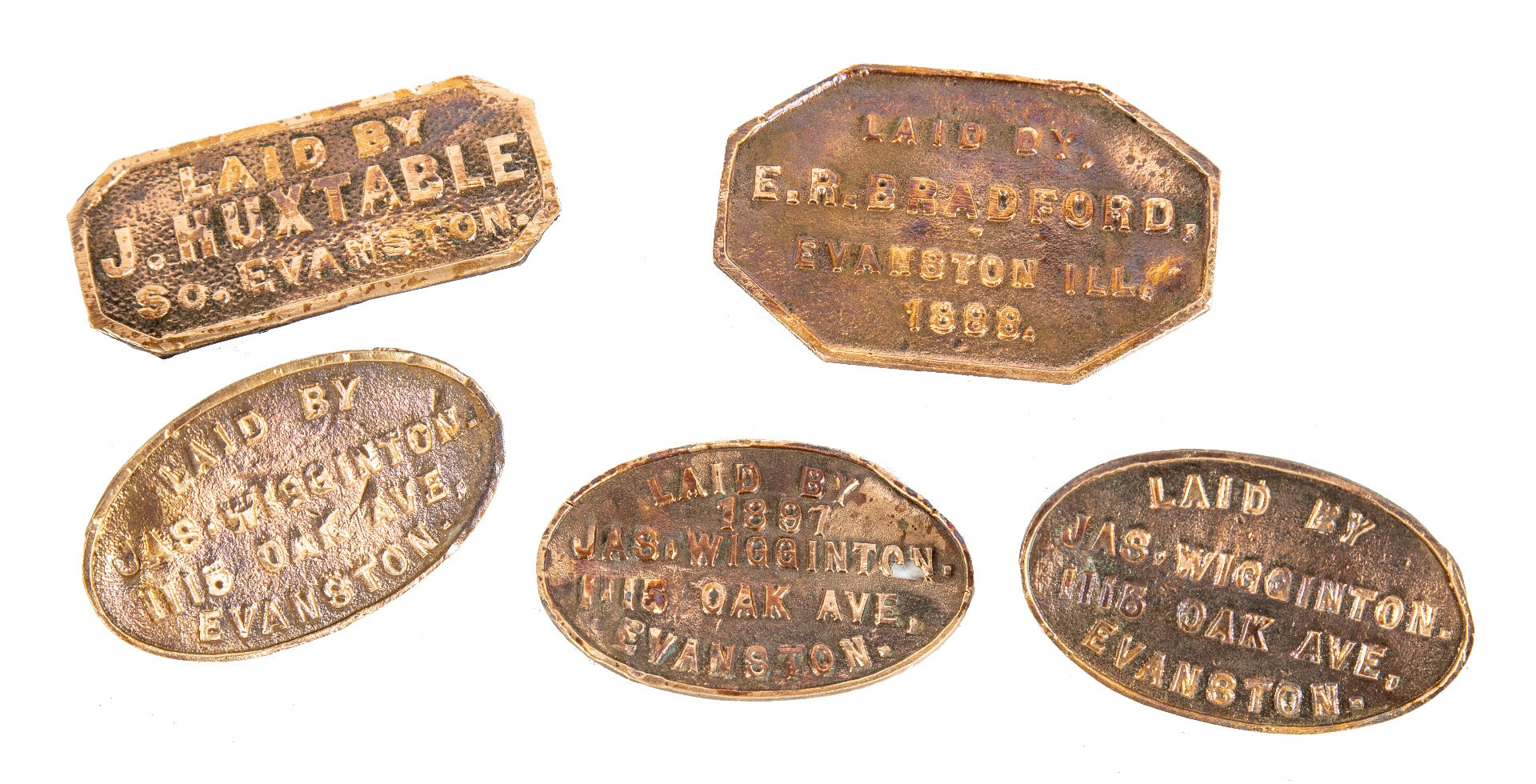 group of very rare 19th and early 20th century cast brass and bronze evanston concrete sidewalk markers