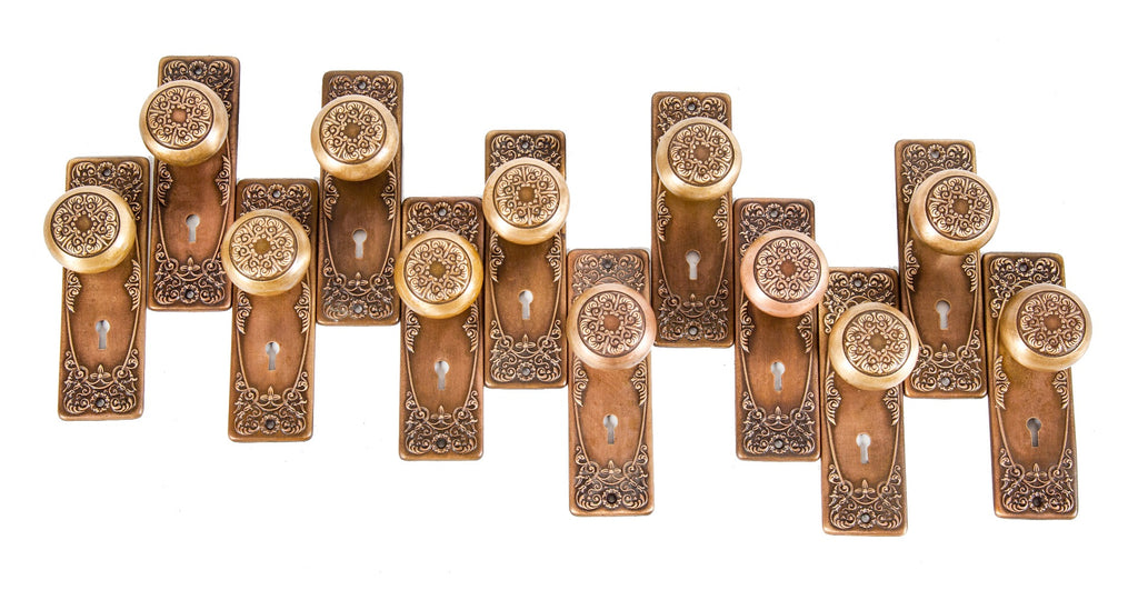 several matching salvaged chicago early 20th century cast brass "alexandria" pattern residential door hardware
