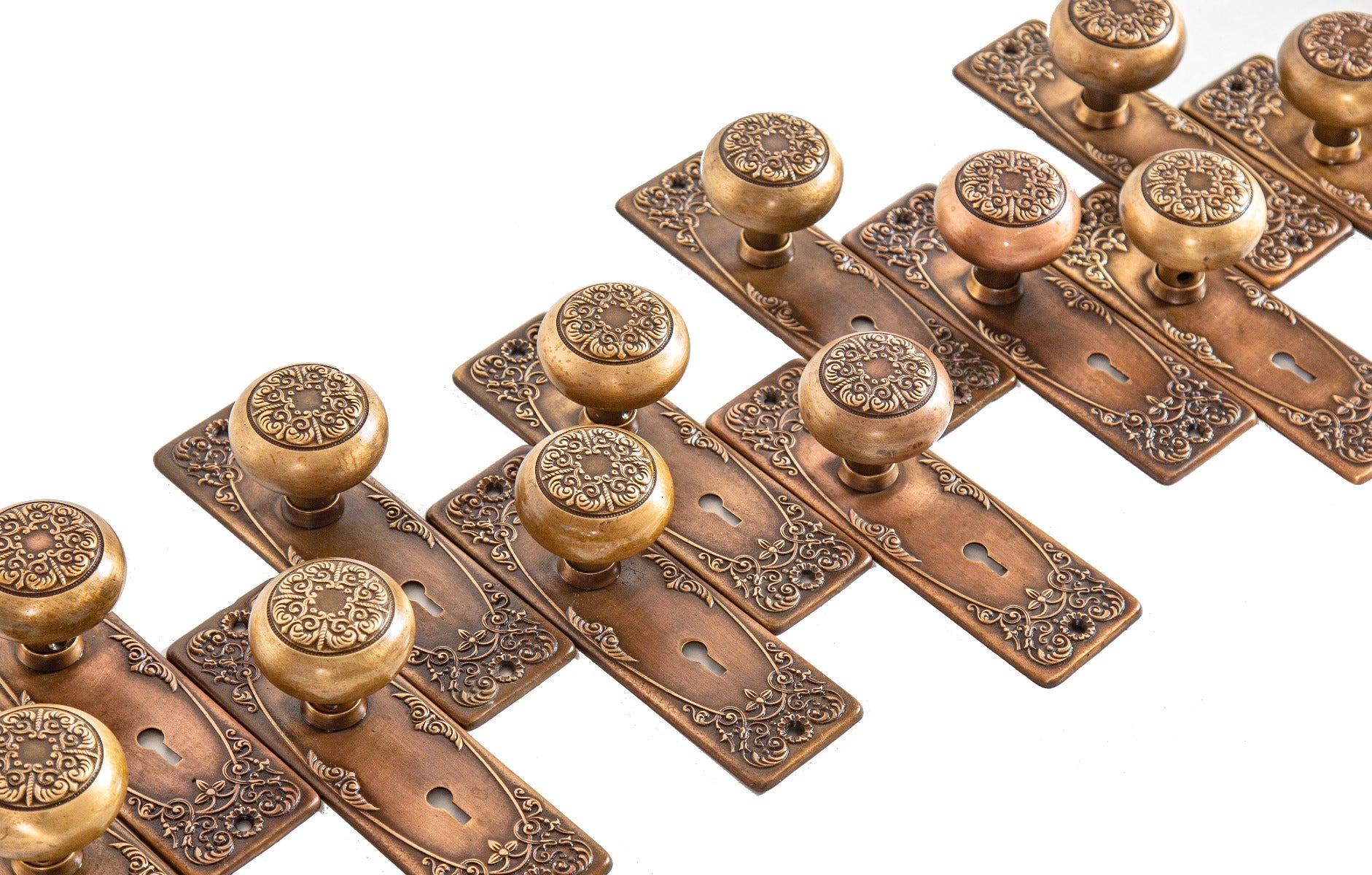 several matching salvaged chicago early 20th century cast brass "alexandria" pattern residential door hardware