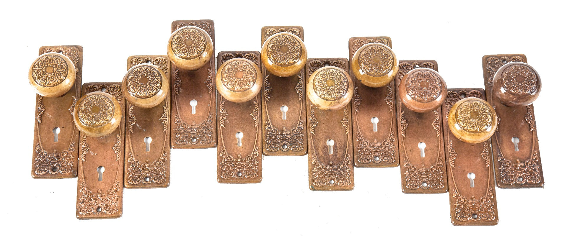 late 19th or early 20th century antique american ornamental cast brass "alexandria" pattern doorknobs and matching backplates