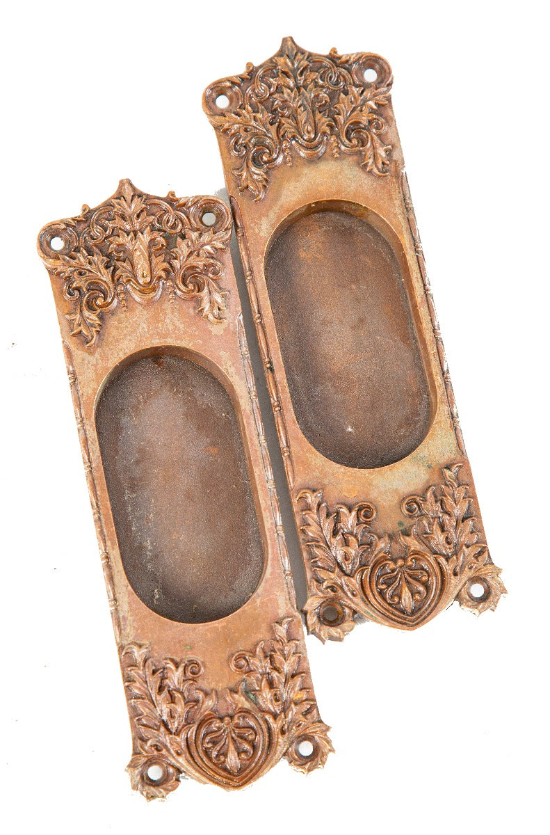 matching pair of original late 19th or early 20th century richardsonian romanesque pattern bronze pocket door plates