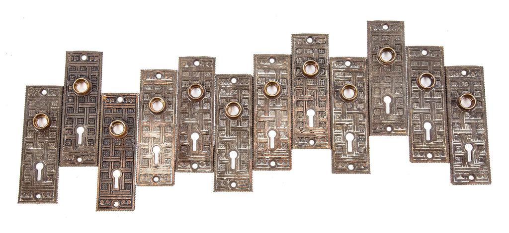 large lot of matching ornamental cast iron passage door backplates with unique lattice work design motif