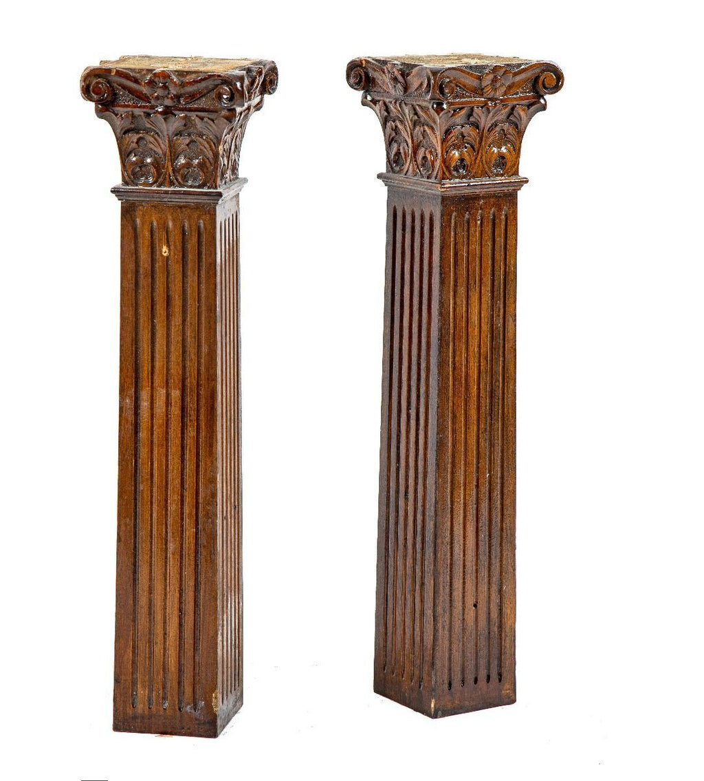 two matching 19th century solid cherry diminutive wood columns with hand-carved capitals