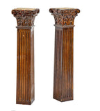 two matching 19th century solid cherry diminutive wood columns with hand-carved capitals