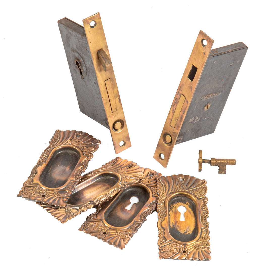 original 19th century ornamental wrought brass salvaged chicago "roanoke" pattern pocket door set with key
