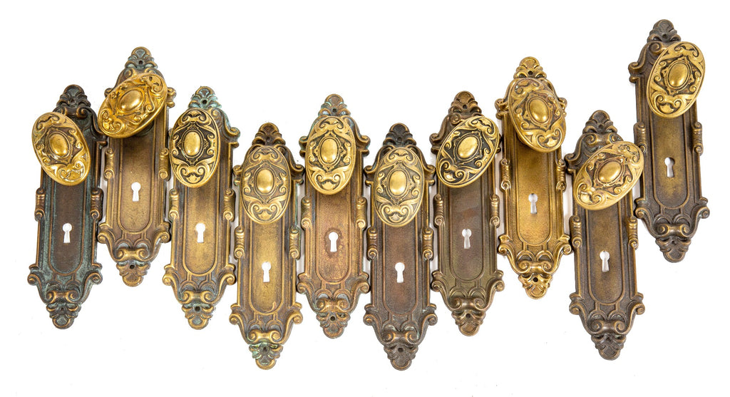 hard to find early 20th century yale and towne "meridian" pattern ornamental brass doorknobs with matching backplates