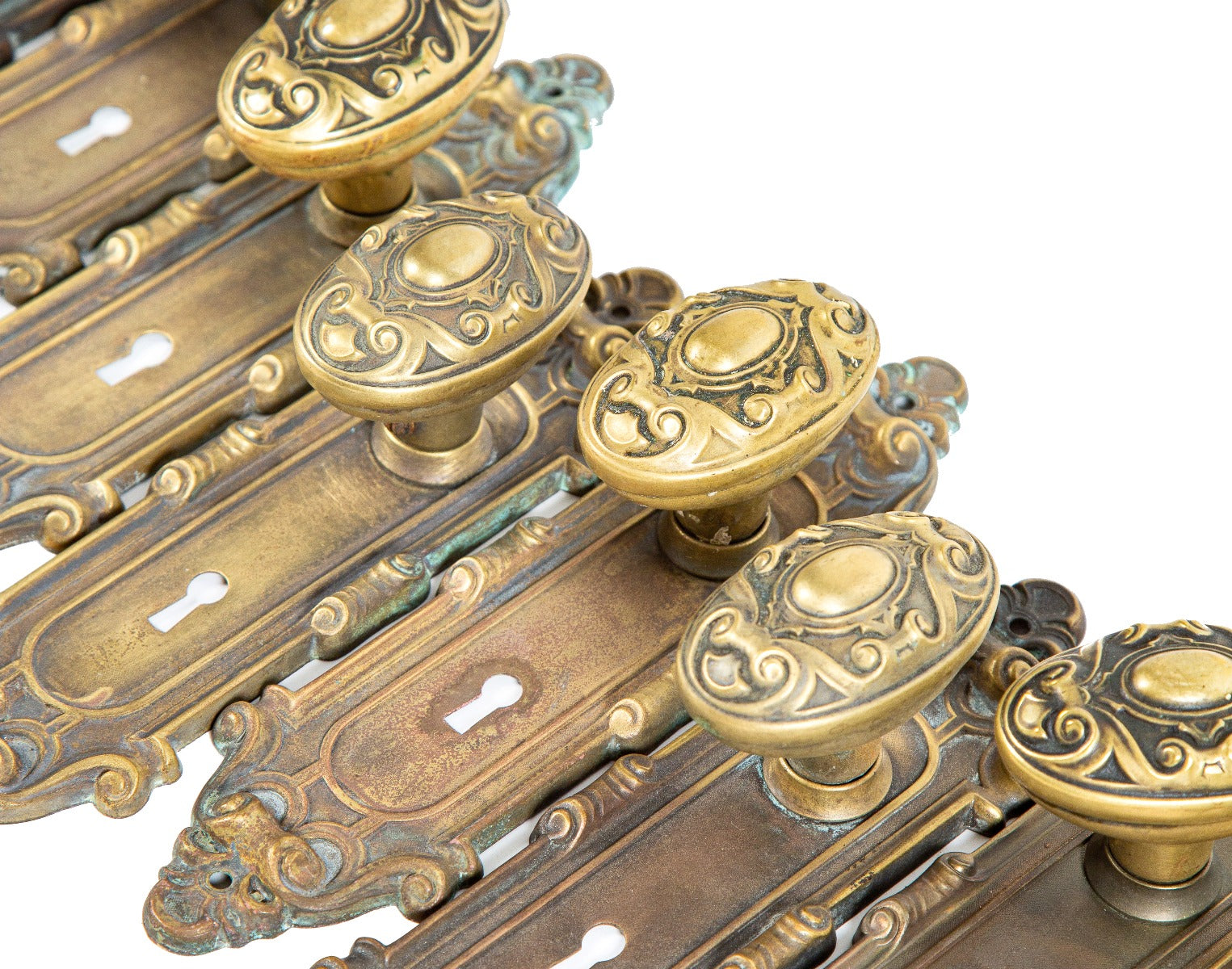 hard to find early 20th century yale and towne "meridian" pattern ornamental brass doorknobs with matching backplates