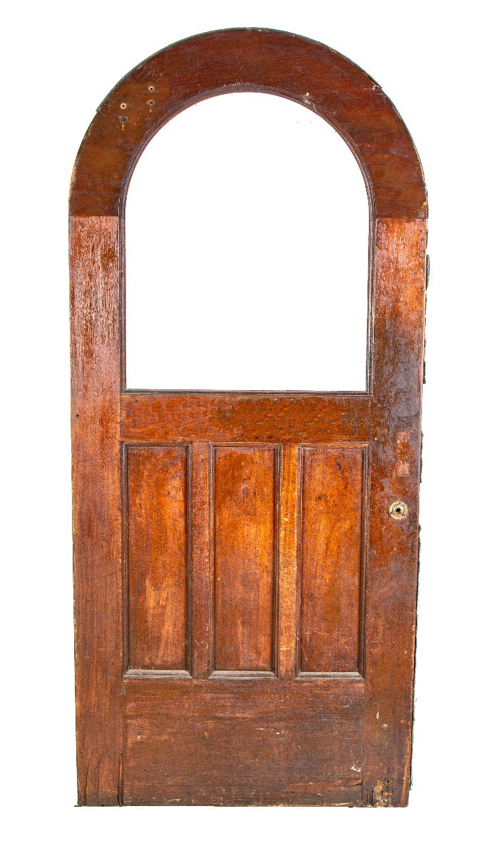 unusual and seldom found oversized exterior salvaged chicago walnut wood entrance door with arch top