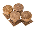 group of four hard to find 19th century ornamental cast brass eastlake style doorknobs with matching squarer-shaped rosettes