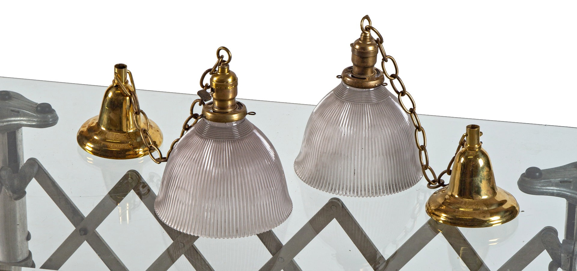two matching original hard to find early 20th century prismatic glass holophane company pendant lights with ribbed sun-purple glass shades