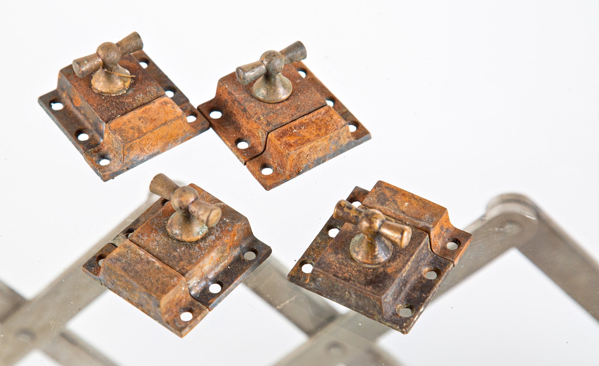 group of four matching heavy duty 1900s antique laboratory cabinet latches with keepers and bronze t-handles