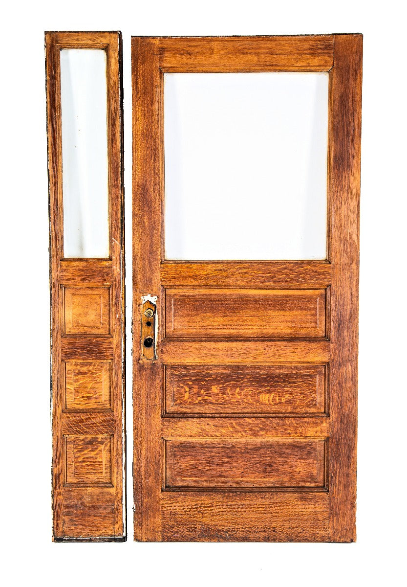 late 19th century original quarter-sawn oak wood salvaged residential entrance door with matching sidelight with beveled glass
